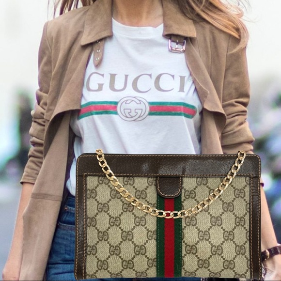 Gucci Handbags - Gucci Web GG monogram clutch crossbody bag.